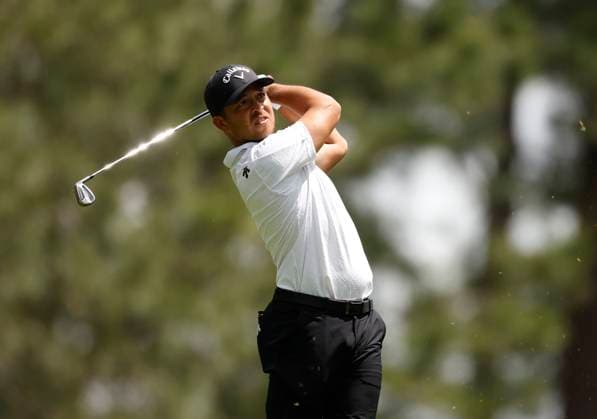 Xander Schauffele hits his tee shot on the fourth hole during the first round of the Masters Tournament at Augusta National Golf Club in Augusta, Georgia on Thursday, April 11, 2024.  AUG20240411134 JOHNxANGELILLO