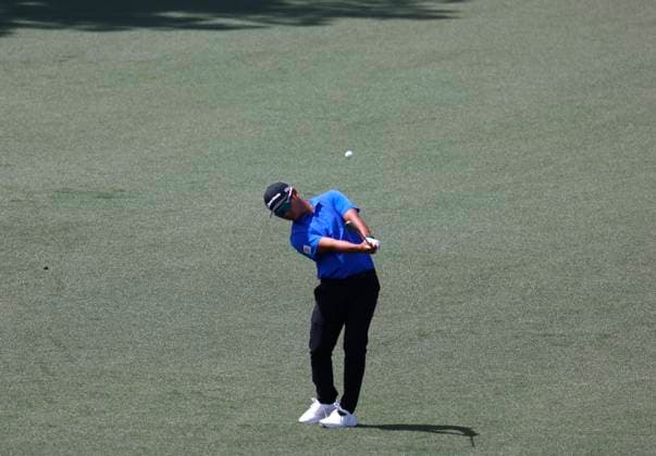 South Korea s Min Woo Lee his an approach shot on the second hole during the first round of the Masters Tournament at Augusta National Golf Club in Augusta, Georgia on Thursday, April 11, 2024.  AUG20240411570 TANNENxMAURY