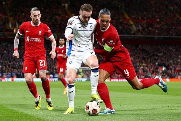 Virgil van Dijk of Liverpool battles with Teun Koopmeiners of Atalanta Liverpool v Atalanta, UEFA Europa League, Quarter Final, First Leg, Football, Anfield, Liverpool, UK - 11 Apr 2024 EDITORIAL USE ONLY No use with unauthorised audio, video, data, fixture lists, club league logos or live services. Online in-match use limited to 120 images, no video emulation. No use in betting, games or single club league player publications. Copyright: xMattxWest Shutterstockx 14424886cl