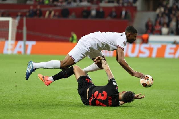 Ben Johnson West Ham United and Granit Xhaka Bayer 04 Leverkusen during the Europa League quarter-final first leg Bayer 04 Leverkusen West Ham United Copyright Thomas Pakusch Copyright: Thomas Pakusch