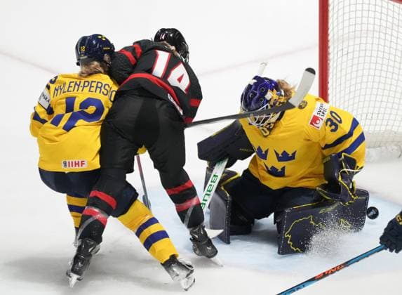 April 11, 2024, Utica, Ny, UNITED STATES: Canada s Renata Fast (14) scores on Sweden goaltender Emma Soderberg (30) during first period quarter final hockey action at the IIHF Women s World Hockey Championship in Utica, N.Y., Thursday, April 11, 2024. Canada News - April 11, 2024  - ZUMAc35_ 20240411_zaf_c35_094 Copyright: xChristinnexMuschix