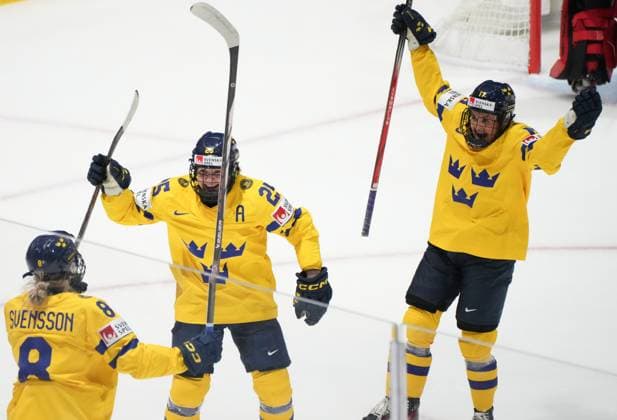April 11, 2024, Utica, Ny, UNITED STATES: Sweden s Hilda Svensson (8) celebrates her goal on Canada with teammates Lina Ljungblom (25) and Sofie Lundin (17)during first period quarter final hockey action at the IIHF Women s World Hockey Championship in Utica, N.Y., Thursday, April 11, 2024. Canada News - April 11, 2024  - ZUMAc35_ 20240411_zaf_c35_098 Copyright: xChristinnexMuschix