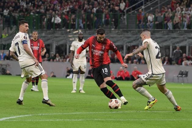 11th April 2024, Stadio San Siro, Milan, Italy; Europa League, Quarter- finals 1st leg; Milan versus Roma; Theo Hernandez of AC Milan takes on Gianluca Mancini of AS Roma  ActionPlus12628620 AllShotLive