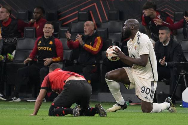 11th April 2024, Stadio San Siro, Milan, Italy; Europa League, Quarter- finals 1st leg; Milan versus Roma; Romelu Lukaku of AS Roma checks on an injured Milan player  ActionPlus12628665 AllShotLive