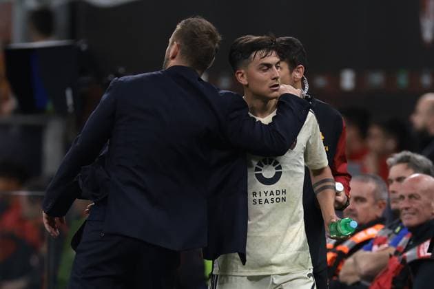 Milan, Italy, 11th April 2024. Daniele De Rossi Head coach of AS Roma embraces Paulo Dybala of AS Roma after substituting him during the UEFA Europa League match at Giuseppe Meazza, Milan. Picture credit should read: Jonathan Moscrop Sportimage EDITORIAL USE ONLY. No use with unauthorised audio, video, data, fixture lists, club league logos or live services. Online in-match use limited to 120 images, no video emulation. No use in betting, games or single club league player publications. SPI-3069-0031