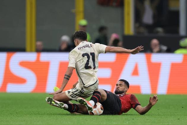 Milan, Italy, 11th April 2024. Ruben Loftus-Cheek of AC Milan fouls Paulo Dybala of AS Roma earning himself a yellow card during the UEFA Europa League match at Giuseppe Meazza, Milan. Picture credit should read: Jonathan Moscrop Sportimage EDITORIAL USE ONLY. No use with unauthorised audio, video, data, fixture lists, club league logos or live services. Online in-match use limited to 120 images, no video emulation. No use in betting, games or single club league player publications. SPI-3069-0034