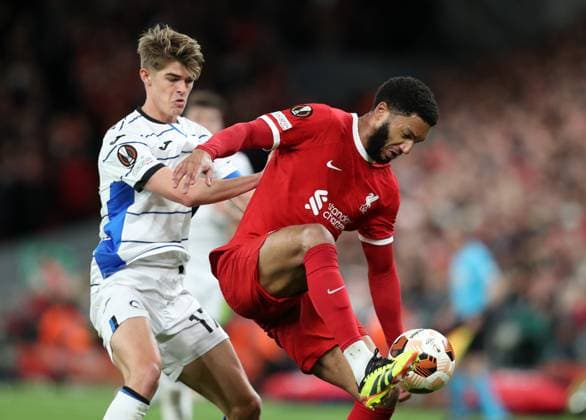 11th April 2024; Anfield, Liverpool, Merseyside, England; Europa League, Quarter Final;, First Leg Football, Liverpool versus Atalanta; Joe Gomez of Liverpool controls the ball under pressure from Charles de Ketelaure of Atalants  ActionPlus12628782 DavidxBlunsden