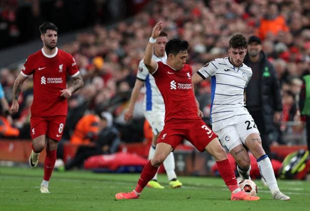 11th April 2024; Anfield, Liverpool, Merseyside, England; Europa League, Quarter Final;, First Leg Football, Liverpool versus Atalanta; Matteo Ruggieri of Atalanta is tackled by Wataru Endo of Liverpool  ActionPlus12628786 DavidxBlunsden
