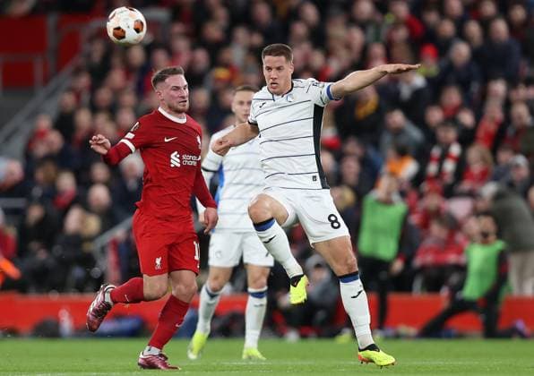 . - Liverpool v Atalanta, UEFA Europa League, Quarter-Final first leg, Anfield Stadium, Liverpool, UK. - 11th April 2024. Mario Pasalic of Atalanta battles Alexis Mac Allister of Liverpool. - Liverpool v Atalanta, UEFA Europa League, Quarter-Final first leg, Anfield Stadium, Liverpool, UK. - 11th April 2024. Liverpool Anfield Stadium UK Copyright: xDanxWeirx CP_Liverpool_Atalanta_121