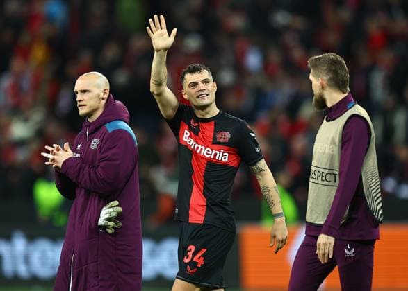 Granit Xhaka of Beyer Leverkusen acknowledges the fans Bayer 04 Leverkusen v West Ham United, UEFA Europa League, Quarter Final, First Leg, Football, BayArena, Leverkusen, Germany - 11 Apr 2024 EDITORIAL USE ONLY No use with unauthorised audio, video, data, fixture lists, club league logos or live services. Online in-match use limited to 120 images, no video emulation. No use in betting, games or single club league player publications.  Copyright: xMichaelxZemanek Shutterstockx 14424882co