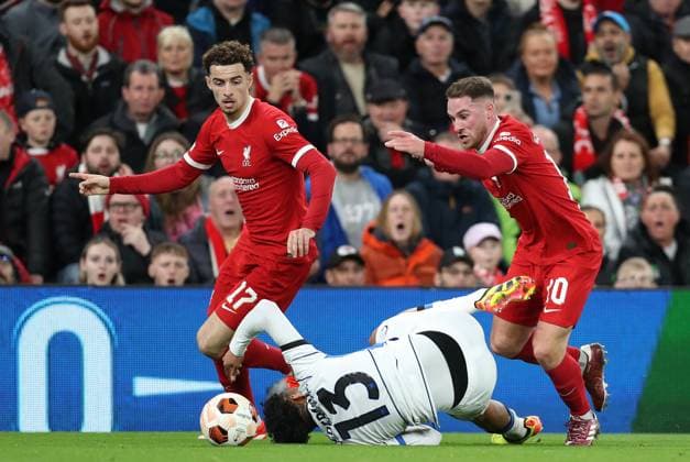 11th April 2024; Anfield, Liverpool, Merseyside, England; Europa League, Quarter Final;, First Leg Football, Liverpool versus Atalanta; Alexis MacAllister of Liverpool is tripped by Ederson of Atalanta  ActionPlus12628887 DavidxBlunsden