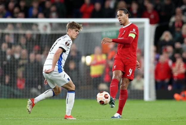 11th April 2024; Anfield, Liverpool, Merseyside, England; Europa League, Quarter Final;, First Leg Football, Liverpool versus Atalanta; Virgil van Dijk of Liverpool passes the ball under pressure from Charles de Ketelaure of Atalants  ActionPlus12628897 DavidxBlunsden