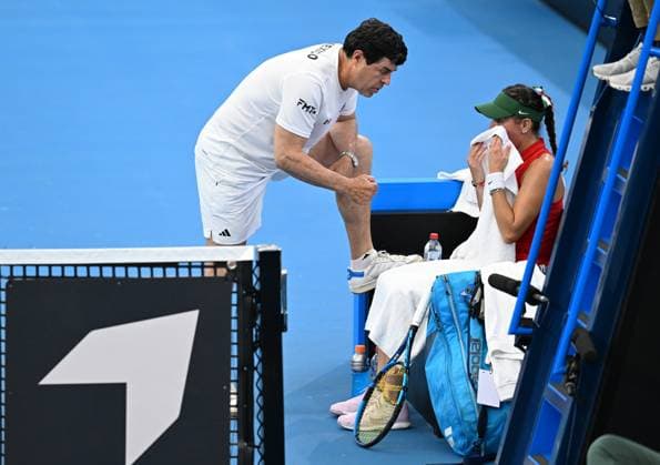 TENNIS BILLIE JEAN KING CUP, Agustin Moreno (left), captain of Mexico is seen talking to Giuliana Olmos (right) of Mexico during her singles match against Arina Rodionova of Australia during the Billie Jean King Cup at Pat Rafter Arena in Brisbane, Friday, April 12, 2024. ( NO ARCHIVING, EDITORIAL USE ONLY, NO USE IN BOOKS WITHOUT CONSENT BRISBANE QUEENSLAND AUSTRALIA  Copyright: xDARRENxENGLANDx 20240412001930889299