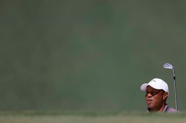 Tiger Woods watches his shot out of a bunker on the seventh green in the second round of the Masters Tournament at Augusta National Golf Club in Augusta, Georgia on Friday, April 12, 2024.  AUG20240412526 TANNENxMAURY