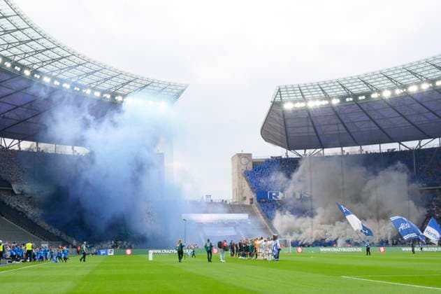 Pyro action, at the beginning of the match in the Rostock fan block, fog, smoke, fireworks, Hertha BSC FC Hansa Rostock, 2 Bundesliga, football, DFB, 2023 2024 season, 29 match day, Olympia Stadion Berlin, DFB DFL REGULATIONS PROHIBIT ANY USE OF PHOTOGRAPHS AS IMAGE SEQUENCES AND OR QUASI VIDEO, 12 04 2024, Copyright: HMBxMedia UwexKoch