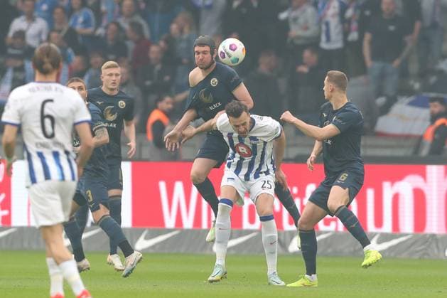 12 04 2024, xtgx, Football 2 Bundesliga, Hertha BSC Hansa Rostock emspor, v l Damian Rossbach Roßbach, Rostock, 4 , Haris Tabakovic Hertha, 25 duel, duel, fight, tackle DFL DFB REGULATIONS PROHIBIT ANY USE OF PHOTOGRAPHS as IMAGE SEQUENCES and or QUASI VIDEO Berlin