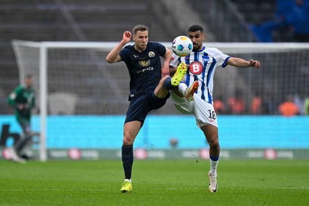 2 Bundesliga Hertha BSC Berlin FC Hansa Rostock on 12 04 2024 at Olympiastadion in Berlin Aymane Barkok Hertha BSC Berlin in a duel against Dennis Dressel Rostock MT