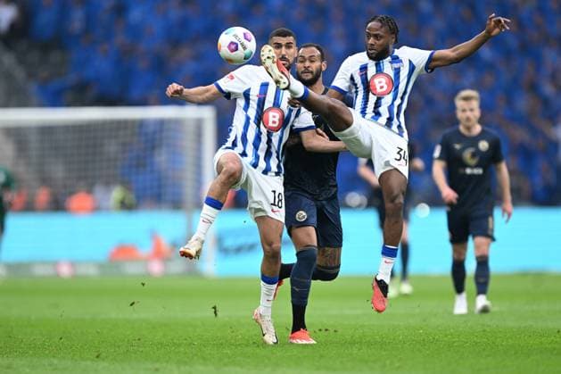 2 Bundesliga Hertha BSC Berlin FC Hansa Rostock on 12 04 2024 at Olympiastadion in Berlin Aymane Barkok Hertha BSC Berlin in a tackle against Junior Brumado Rostock in a tackle against Deyovaisio Zeefuik Hertha BSC Berlin MT