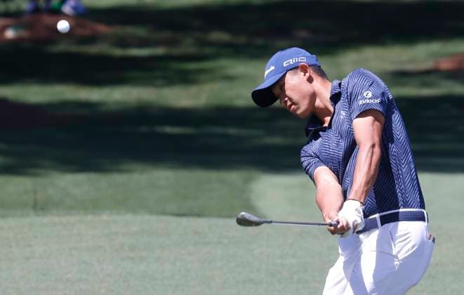 Collin Morikawa chips to the green on the seventh hole in the second round of the Masters Tournament at Augusta National Golf Club in Augusta, Georgia on Friday, April 12, 2024.  AUG20240412540 TANNENxMAURY