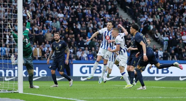 Palko Dardai scores the goal for 1 0 against goalkeeper Markus Kolke Sport Football Soccer DFL 2 Bundesliga Men 29 Matchday Season 2023 2024 12 04 2024 Hertha BSC Berlin vs FC Hansa Rostock DFL regulations prohibit any use of photographs as image sequences and or quasi video