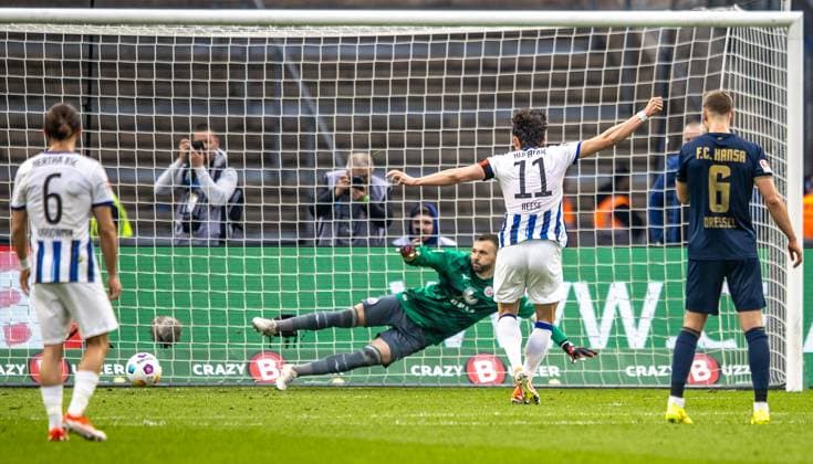 Berlin, 12 04 2024, Soccer, 2 Bundesliga, Matchday 29, Hertha BSC Hansa Rostock, Olympiastadion Berlins Fabian Reese converts penalty kick against goalkeeper Markus Kolke of Hansa Rostock to 2 0 DFL regulations and DFB regulations prohibit any use of photographs as image sequences and or quasi video, Foto Andreas Gora Hertha BSC Hansa Rostock