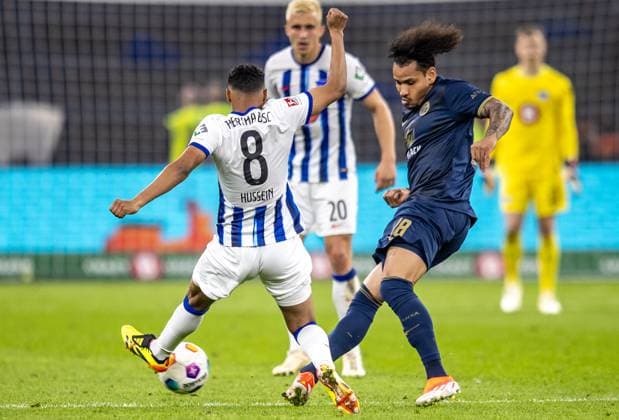 Berlin, 12 04 2024, Soccer, 2 Bundesliga, Matchday 29, Hertha BSC Hansa Rostock, Olympiastadion Berlins Bilal Hussein l fights against Juan Jose Perea of Hansa Rostock for the ball DFL regulations and DFB regulations prohibit any use of photographs as image sequences and or quasi video, Foto Andreas Gora Hertha BSC Hansa Rostock