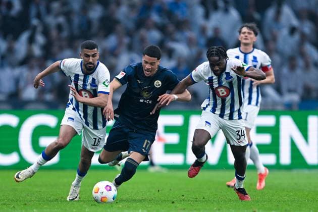 2 Bundesliga Hertha BSC Berlin FC Hansa Rostock on 12 04 2024 at Olympiastadion in Berlin Aymane Barkok Hertha BSC Berlin in a duel against Jonas David Rostock and Deyovaisio Zeefuik Hertha BSC Berlin MT