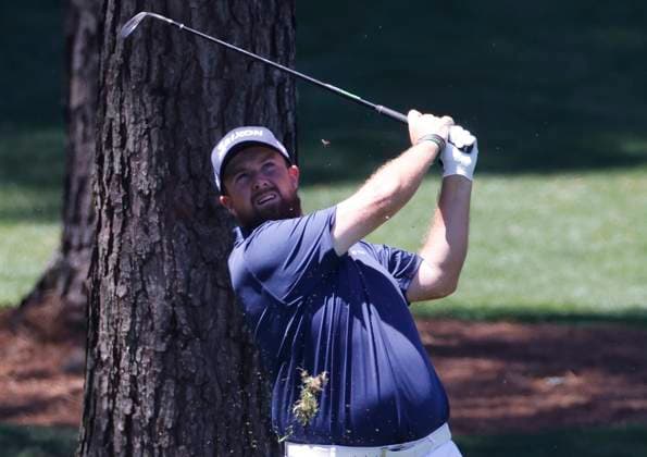 Ireland s Shane Lowry hits an approach shot on the seventh hole during the third round of the Masters Tournament at Augusta National Golf Club in Augusta, Georgia on Saturday, April 13, 2024.  AUG20240413505 TANNENxMAURY