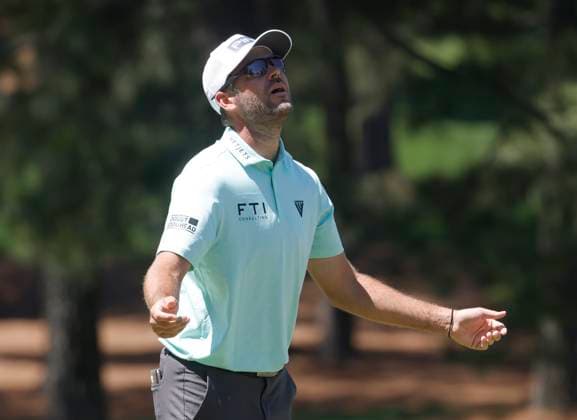 Canada s Corey Conners reacts after missing a putt on the seventh hole during the third round of the Masters Tournament at Augusta National Golf Club in Augusta, Georgia on Saturday, April 13, 2024.  AUG20240413506 TANNENxMAURY