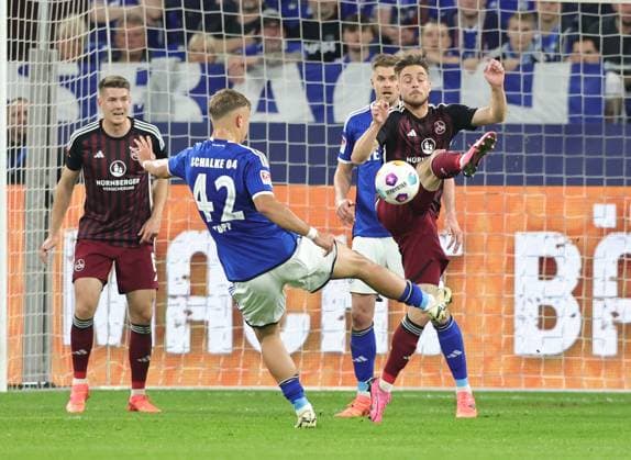 13 04 2024 Soccer Season 2023 2024 2 Soccer Bundesliga 29 Matchday FC Schalke 04 S04 Knappen 1 FC Nuremberg FCN Club Sportfoto Zink DaMa xdaxmax DFL regulations prohibit any use of photographs as image sequences and or quasi video only for editorial use Keke Topp 42, FC Schalke 04 S04 Lukas Schleimer 36, 1 FC Nuremberg FCN