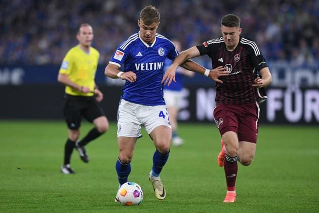 Soccer 2 Bundesliga 29 Matchday FC Schalke 04 1 FC Nürnberg on 13 04 2024 at the Veltins Arena in Gelsenkirchen Keke Maximilian Topp Schalke , left Florian Flick Nürnberg , right DFL regulations prohibit any use of photographs as image sequences and or quasi video xRx