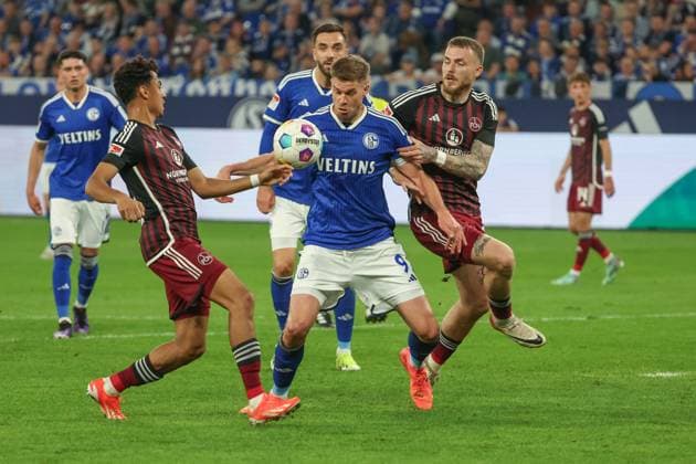 2 Bundesliga FC Schalke 04 1 FC Nürnberg on 13 04 2024 at the Veltins Arena in Schalke Simon Terodde Schalke 9 vs Nathaniel Brown Nuernberg 27 and Jannes Horn Nuernberg 38 MH