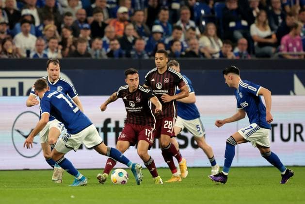 Paul Seguin FC Schalke 04 and Jens Castrop 1 FC Nürnberg at the match of the 2 BL season 2023 24 FC Schalke 04 1 FC Nürnberg Copyright Thomas Pakusch