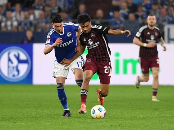 13 04 2024, Gelsenkirchen, Germany, VELTINS Arena, FC Schalke 04 vs 1 FC Nuernberg 2 Bundesliga, Yusuf Kabadayi FC Schalke 04 and Nathaniel Brown 1 FC Nuernberg in duel Photo Ralf Treese DFB DFL REGULATIONS PROHIBIT ANY USE OF PHOTOGRAPHS AS IMAGE SEQUENCES AND OR QUASI VIDEO Gelsenkirchen VELTINS Arena North Rhine Westphalia Germany 521_S04FCN20240413_023 Treese-521