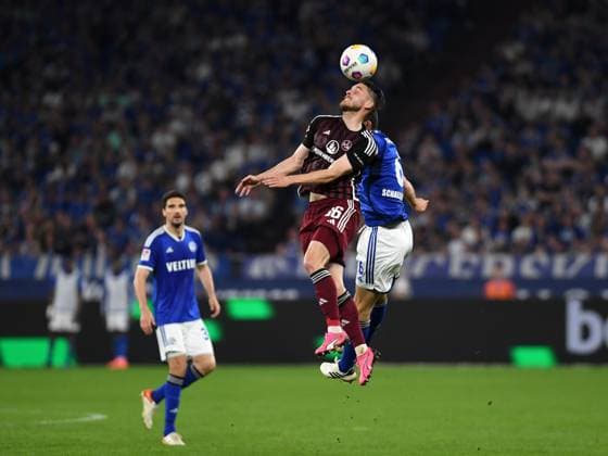 13 04 2024, Gelsenkirchen, Germany, VELTINS Arena, FC Schalke 04 vs 1 FC Nuernberg 2 Bundesliga, Lukas Schleimer 1 FC Nuernberg and Ron Schallenberg FC Schalke 04 in a duel Photo Ralf Treese DFB DFL REGULATIONS PROHIBIT ANY USE OF PHOTOGRAPHS AS IMAGE SEQUENCES AND OR QUASI VIDEO Gelsenkirchen VELTINS Arena North Rhine Westphalia Germany 521_S04FCN20240413_039 Treese-521