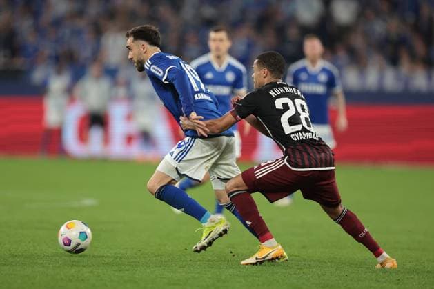 Kenan Karaman FC Schalke 04 and Jan Gyamerah 1 FC Nürnberg at the match of the 2 BL season 2023 24 FC Schalke 04 1 FC Nürnberg Copyright Thomas Pakusch
