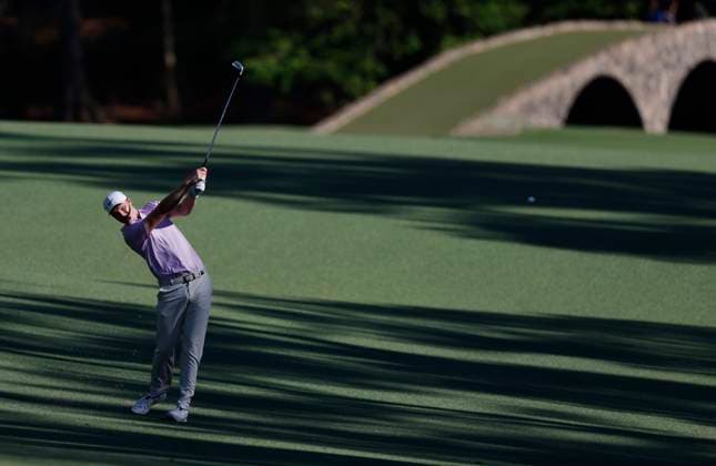 Australia s Cam Davis hits an approach shot on the thirteenth hole during the third round of the Masters Tournament at Augusta National Golf Club in Augusta, Georgia on Saturday, April 13, 2024.  AUG20240413132 JOHNxANGELILLO