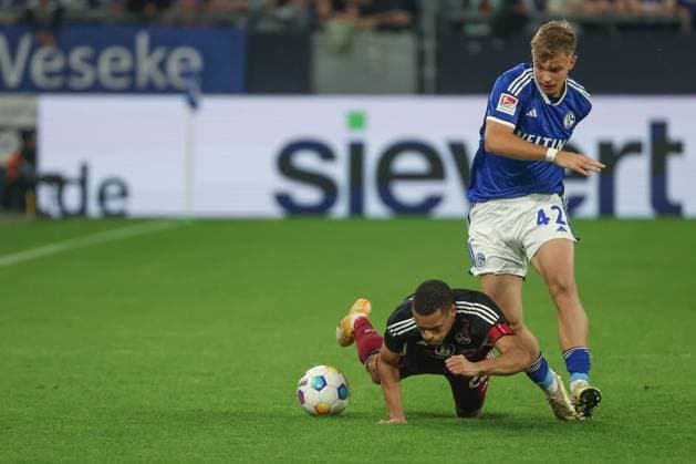 2 Bundesliga FC Schalke 04 1 FC Nürnberg on 13 04 2024 at the Veltins Arena in Schalke Keke Topp Schalke 42 vs Jan Gyamerah Nuernberg 28 MH