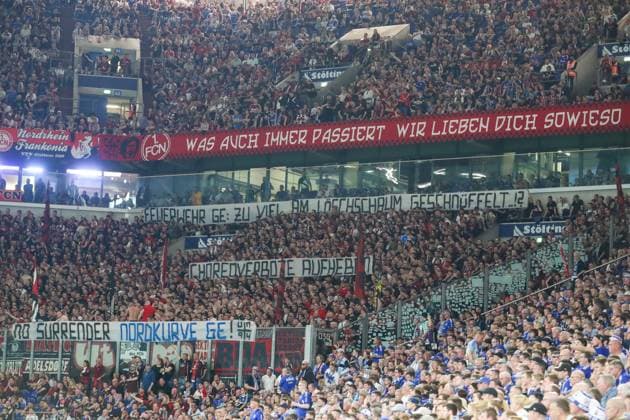 2 Bundesliga FC Schalke 04 1 FC Nürnberg on 13 April 2024 in the Veltins Arena on Schalke The Nürnberg fans in the guest block with banners banners banners against choreo bans MH