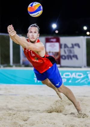 (240414) -- LAGUNA PROVINCE, April 14, 2024 -- Czech Republic s Adam Miroslav Stocek saves the ball during the men s quarterfinals match between Toms Liepa Ernests Puskundzis of Latvia and Tomas Semerad Adam Miroslav Stocek of Czech Republic at the Volleyball World Beach Pro Tour Futures in Laguna Province, the Philippines, April 13, 2024. ) (SP)THE PHILIPPINES-LAGUNA PROVINCE Beach volleyball, Beachvolleyball BEACH PRO TOUR FUTURES-QUARTERFINALS ROUELLExUMALI 
