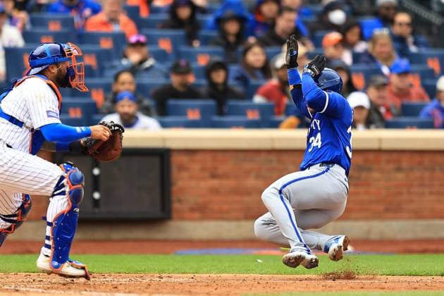 MLB, Baseball Herren, USA Kansas City Royals Vs New York Mets Kansas City Royals Freddy Fermin 34 is sliding into home plate to score while New York Mets catcher Omar Narvaez 2 is catching during the sixth inning of a baseball game at Citi Field in New York City, New York, on April 13, 2024. New York N.Y. United States  Copyright: xGordonxDonovanx originalFilename:donovan-kansasci240413_npQ6h.jpg