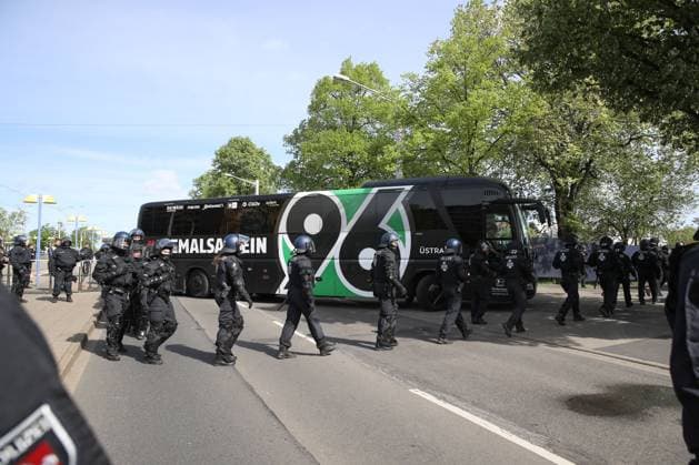 14 04 2024, xtgx, Soccer 2 Bundesliga, Soccer 2 Bundesliga, Eintracht Braunschweig Hannover 96 emspor, v l arrival of Hannover 96 bus with police protection, symbol photo, symbol image police, police officers, derby, security, water cannon DFL DFB REGULATIONS PROHIBIT ANY USE OF PHOTOGRAPHS as IMAGE SEQUENCES and or QUASI VIDEO Braunschweig