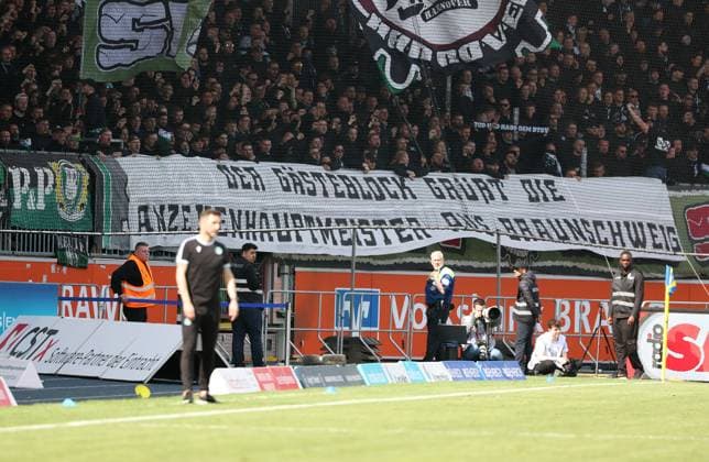 Braunschweig vs Hannover, 2 BL Braunschweig, 14 04 2024, FOOTBALL Eintracht Braunschweig vs Hannover 96, 2 BL, season 2023 24 Hannover 96 fan block with a banner Braunschweig