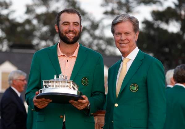 Masters winner Scottie Scheffler (L) stands with Masters chairman Fred Ridley after the final round of the Masters tournament at Augusta National Golf Club in Augusta, Georgia on Sunday, April 14, 2024. Scheffler won with a score of 11 under par.  AUG20240414581 TANNENxMAURY