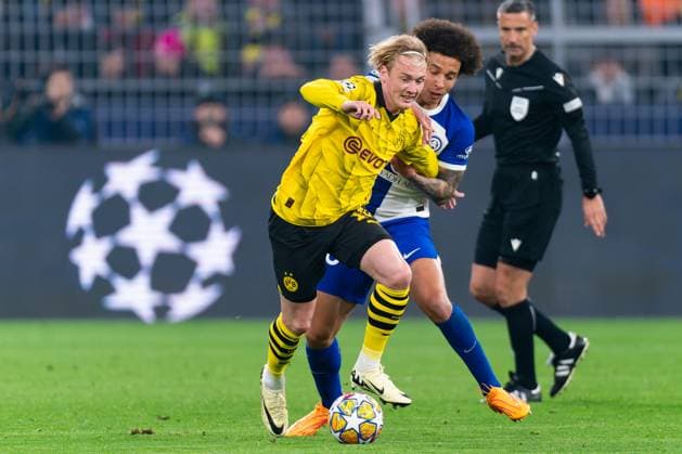 2024-04-16 Borussia Dortmund v Atletico Madrid - Quarter-final Second Leg - UEFA Champions League 2023 24 DORTMUND, GERMANY - APRIL 16: Julian Brandt of Borussia Dortmund battles for the ball with Axel Witsel of Atletico Madrid during the Quarter-final Second Leg - UEFA Champions League 2023 24 match between Borussia Dortmund and Atletico Madrid at Signal Iduna Park on April 16, 2024 in Dortmund, Germany. (Photo by Joris Verwijst BSR Agency) Dortmund Germany Content not available for redistribution in The Netherlands directly or indirectly through any third parties. Copyright: xBSRxAgencyx