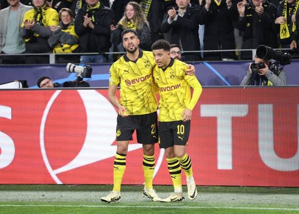 Jadon Sancho of Borussia Dortmund celebrates scoring his sides second goal with team-mate Emre Can of Borussia Dortmund Borussia Dortmund v Atletico Madrid, UEFA Champions League, Quarter Final, Second Leg, Football, Signal Iduna Park, Dortmund, Germany - 16 Apr 2024 EDITORIAL USE ONLY No use with unauthorised audio, video, data, fixture lists, club league logos or live services. Online in-match use limited to 120 images, no video emulation. No use in betting, games or single club league player publications.  Copyright: xMichaelxZemanek Shutterstockx 14434932y