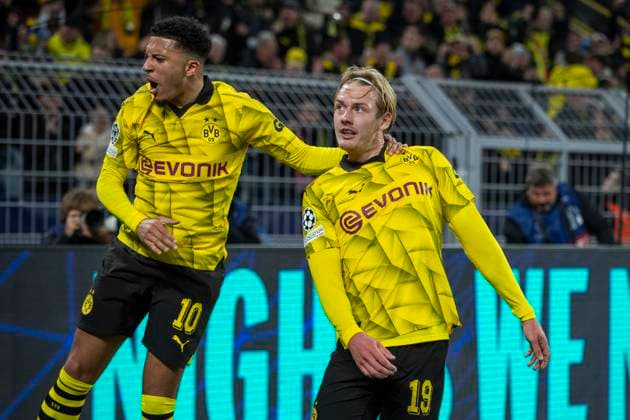 UEFA Champions League, Borussia Dortmund Atletico Madrid, 16 04 2023 Julian Brandt Borussia Dortmund, 19 and Jadon Sancho Borussia Dortmund, 10 cheer UEFA Champions League, Borussia Dortmund Atletico Madrid, second leg quarter-final, on 16 04 2023, Signal Iduna Park, Dortmund UEFA regulations prohibit any use of photographs as image sequences and or quasi video Copyright: xBEAUTIFULxSPORTS Meuselx