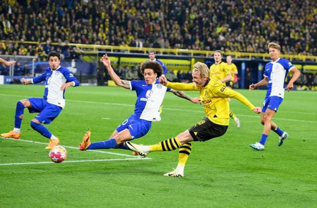 Julian BRANDT DO shoots the goal for 1 0, action, duel, f l Axel WITSEL AM , Julian BRANDT DO , Football Champions League, quarter-final, second leg, Borussia Dortmund DO Atletico Madrid AM , on 16 04 2024 in Dortmund Germany UEFA regulations prohibit any use of photographs as image sequences and or quasi video Â