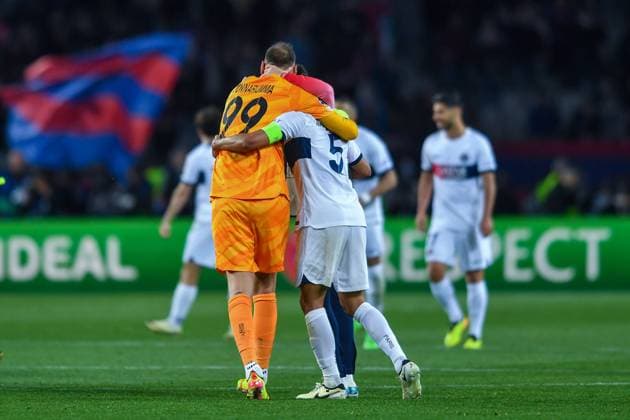 FC Barcelona, Barca v PARIS SAINT-GERMAIN OLIMPIC STADIUM LLUIS COMPANYS. MONTJUIC,BARCELONA. APRIL 16,2024 FC BARCELONA vs PARIS SAINT-GERMAIN April 16,2024 (99) Gianluigi Donnarumma (GK) of PSG celebrates with (05) Marquinhos of PSG at the end of the soccer match corresponding to the quarter-final tie of the Champions League between FC Barcelona and Paris Saint-Germain at Olimpic Stadium Lluis Companys of MontjuÃ¯c in Barcelona, Spain. Barcelona ESP Copyright: xS.xRosx