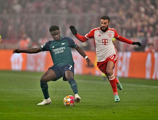 17 04 2024, Football UEFA Champions League 2023 2024 quarter-finals, FC Bayern Munich FC Arsenal London, at Allianz Arena Munich v l Bukayo Saka FC Arsenal v Noussair Mazraoui FC Bayern Munich DFL and DFB regulations prohibit any use of photographs as image sequences and or quasi video